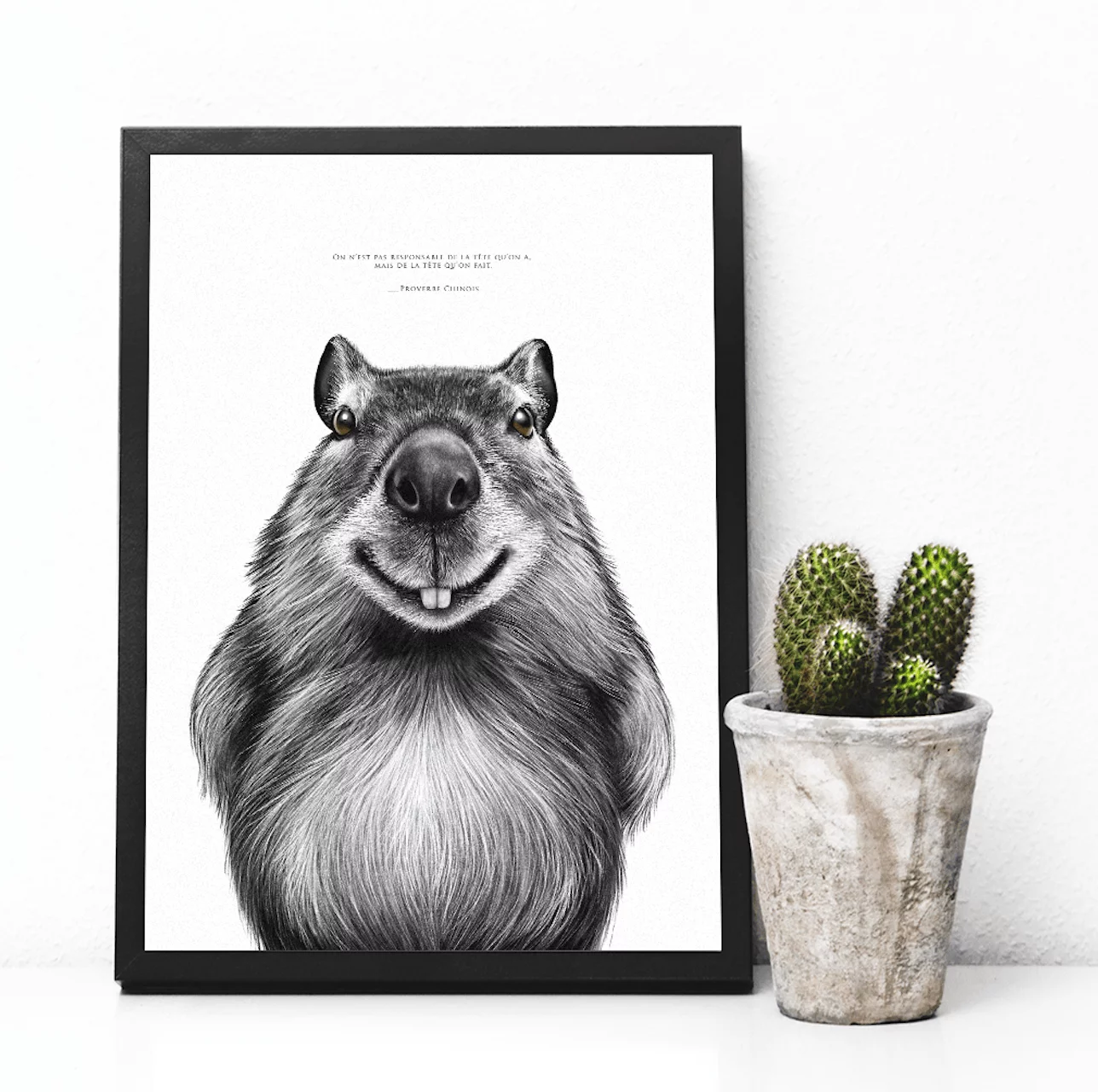Dessin de capybara accompagné d'un proverbe chinois : "on est pas responsable de la tête qu'on a, mais de la tête qu'on fait". Disponible en affiche 30 X 40 cm. Dessin de Marjorie Esquerre pour Décopositive